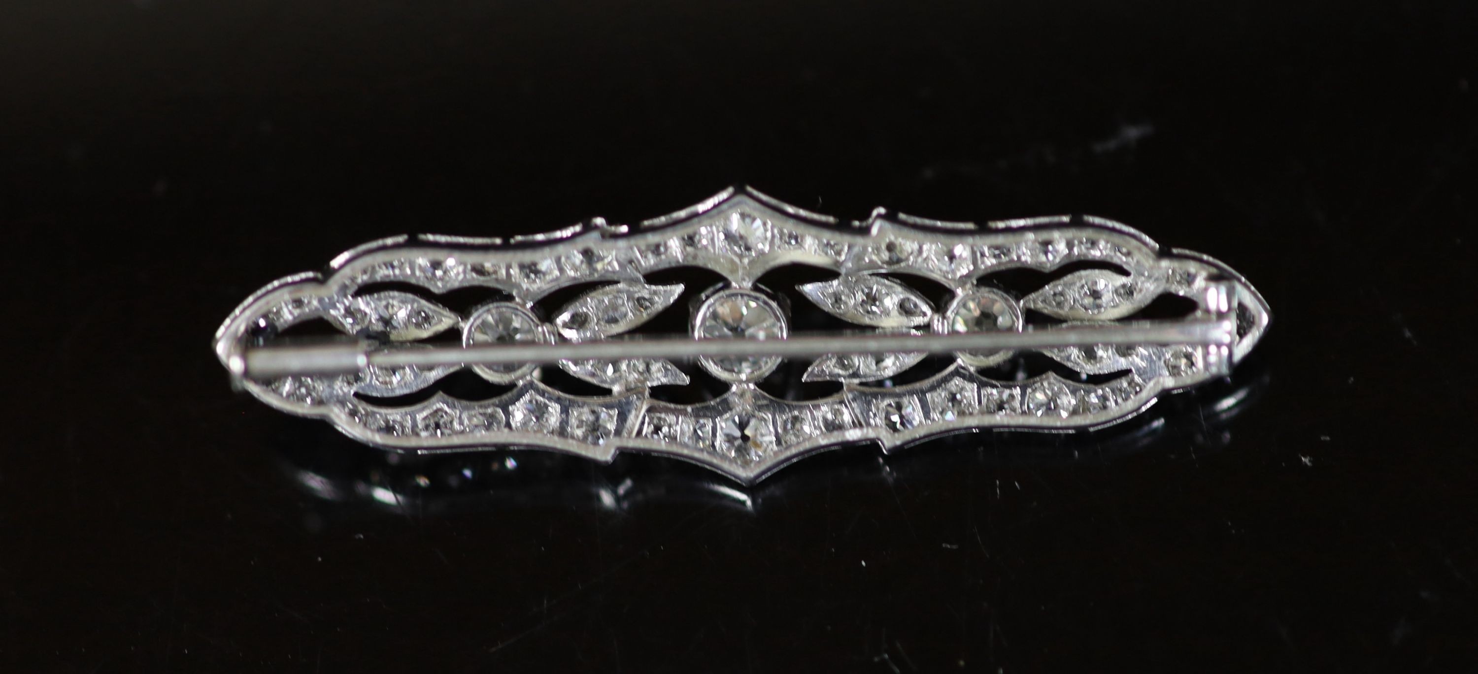 A mid 20th century pierced platinum and diamond cluster set brooch